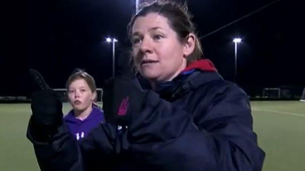 Wendy Russell uses sign language to coach deaf hockey players