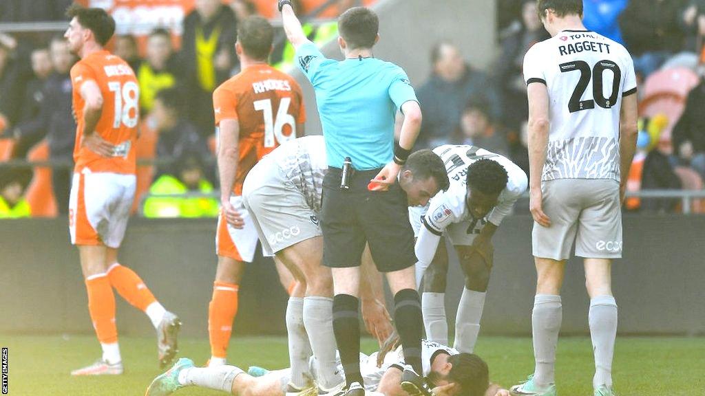 Football player Jordan Rhodes being sent off for Blackpool against Portsmouth