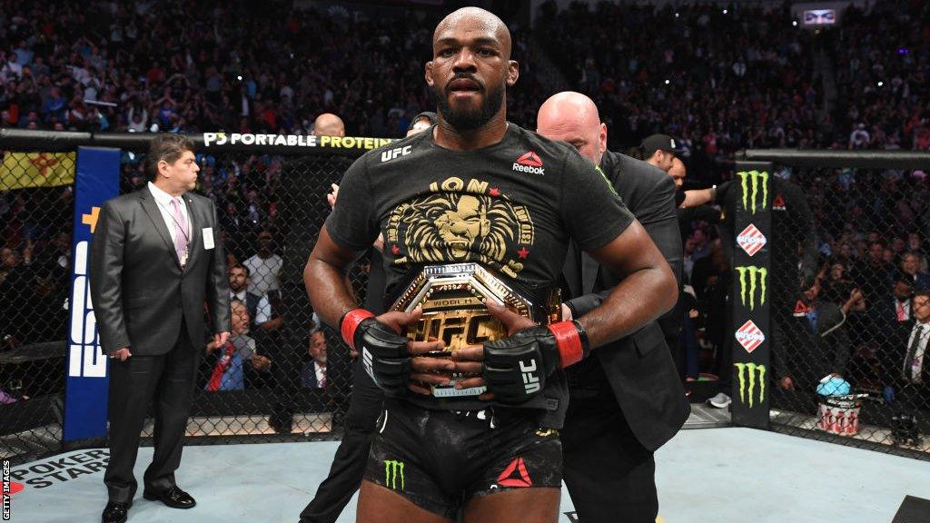 Jon Jones with his UFC title around his waist after a win