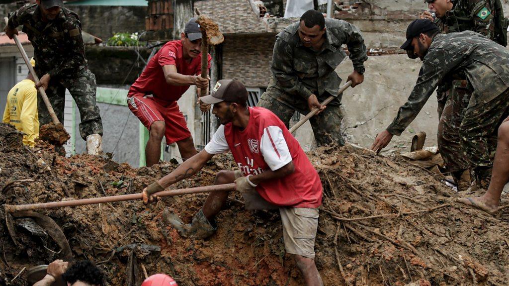 Rescuers dig through landslide mud