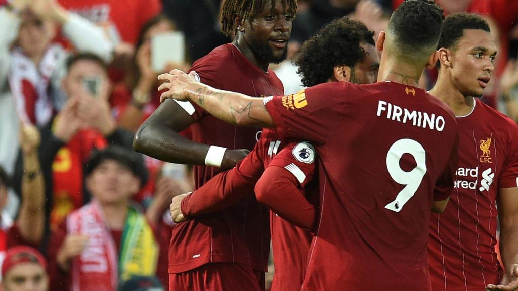 Divock Origi celebrates with Liverpool team-mates