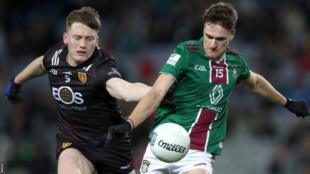 Down's Odhran Murdock tackles Robbie Forde of Westmeath