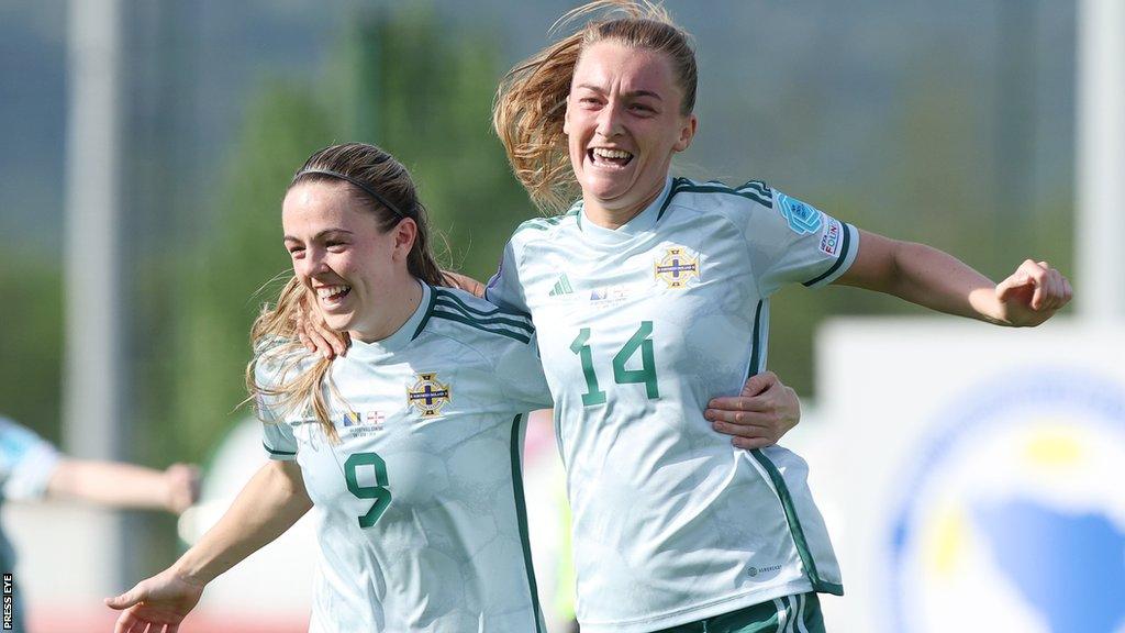 Simone Magill and Lauren Wade celebrate scoring a goal