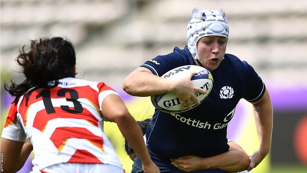 Lana Skeldon (right) runs with the ball for Scotland