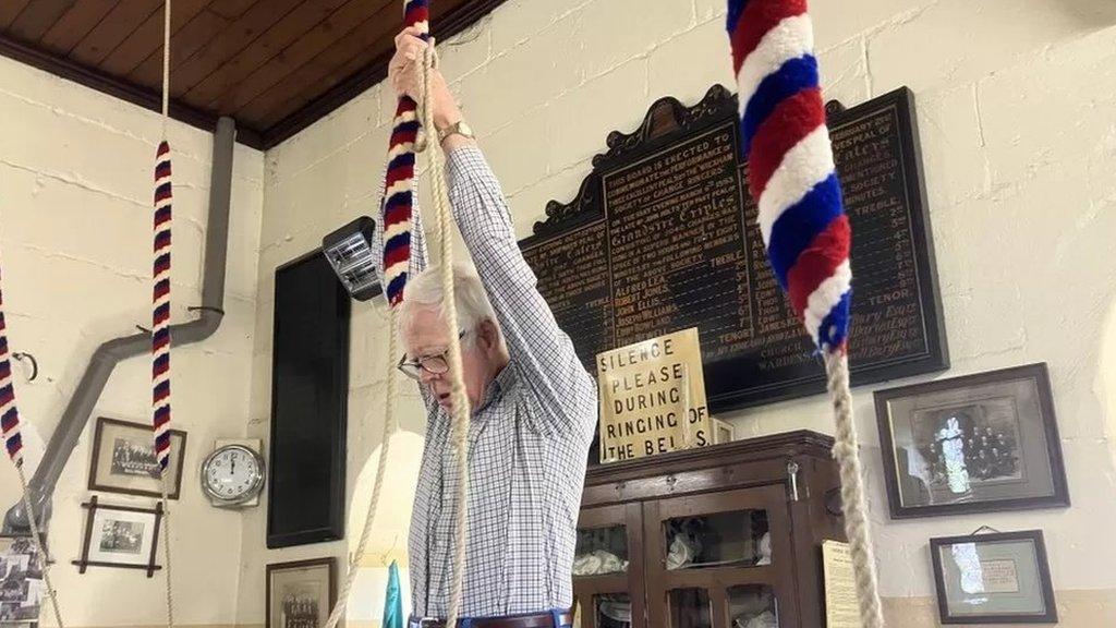 Man-ringing-church-bell.