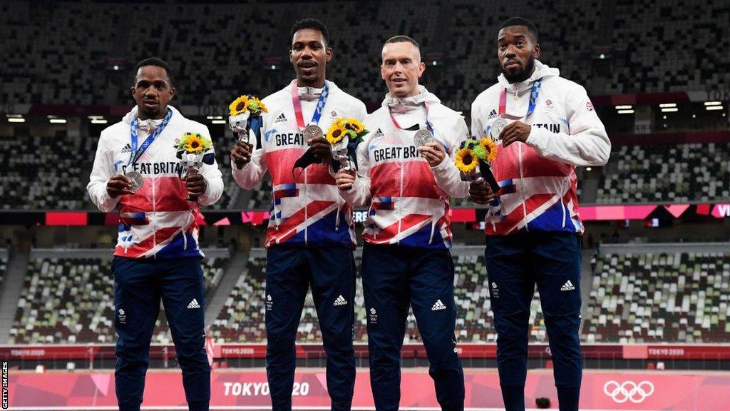 Britain's Chijindu Ujah, Britain's Zharnel Hughes, Britain's Richard Kilty, Britain's Nethaneel Mitchell-Blake on the podium at Tokyo 2020