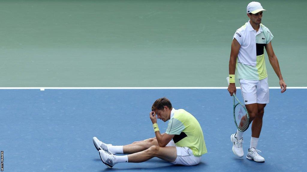 Nicolas Mahut on the ground during his US Open men's doubles semi-final match