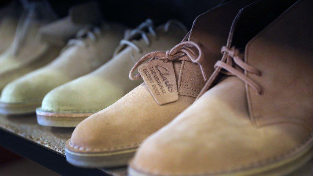 Clarks desert boots on a shelf