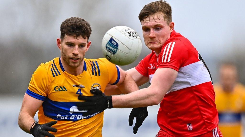 Derry's Ethan Doherty battles with Clare's Ronan Lanigan