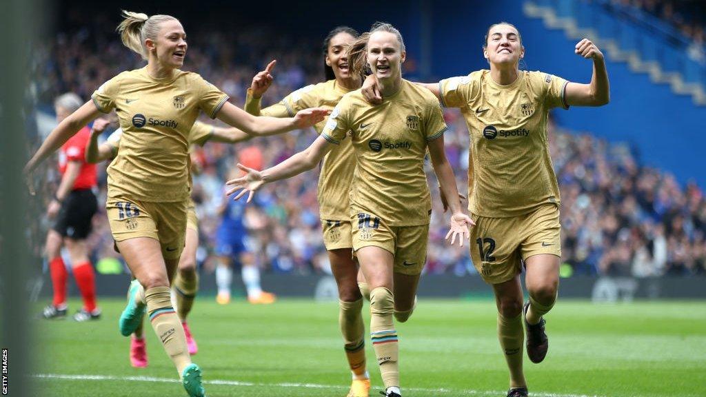 Barcelona players celebrate their goal against Chelsea