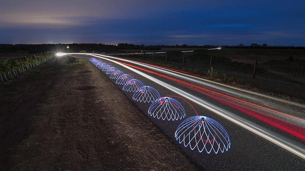 Light domes along country lane in Fingringhoe