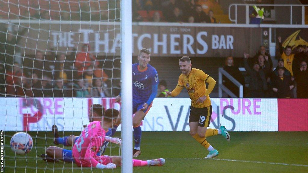 Shane McLoughlin strikes his first goal of the game for Newport County