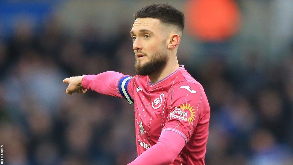 Matt Grimes wearing Swansea's pink third kit at Birmingham City last month