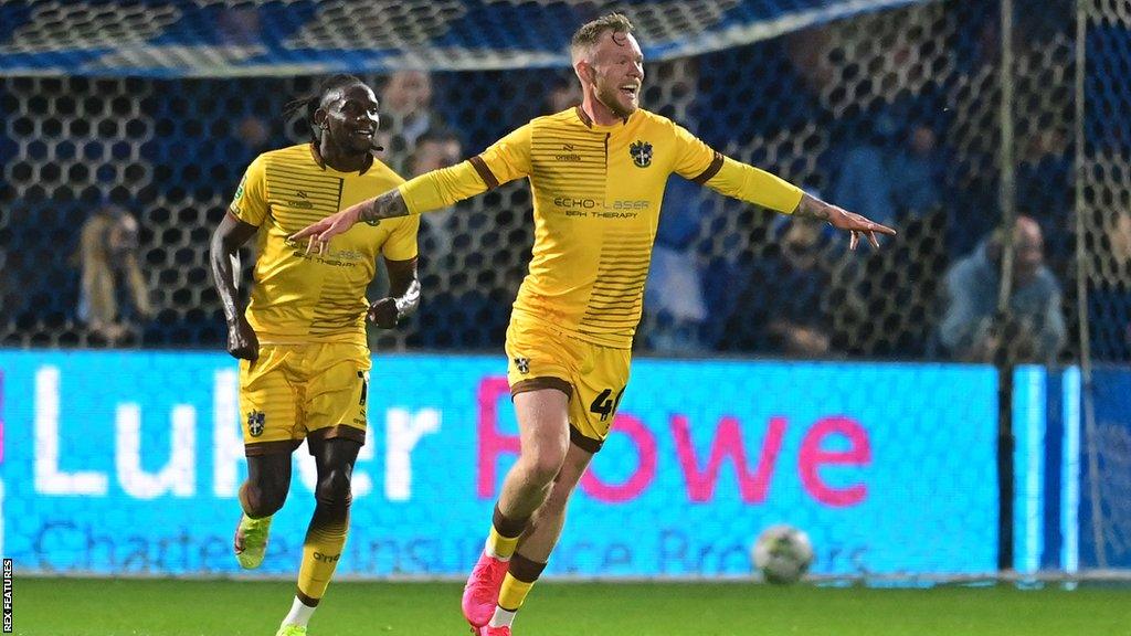 Aidan O'Brien celebrates his goal for Sutton in the Carabao Cup