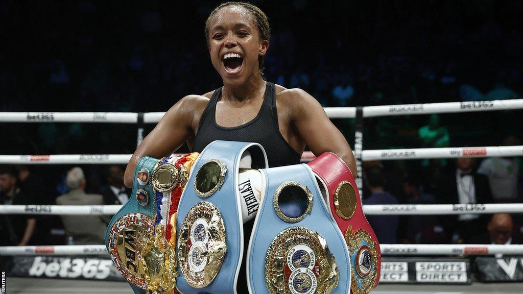 Natasha Jonas shows off all her world title belts