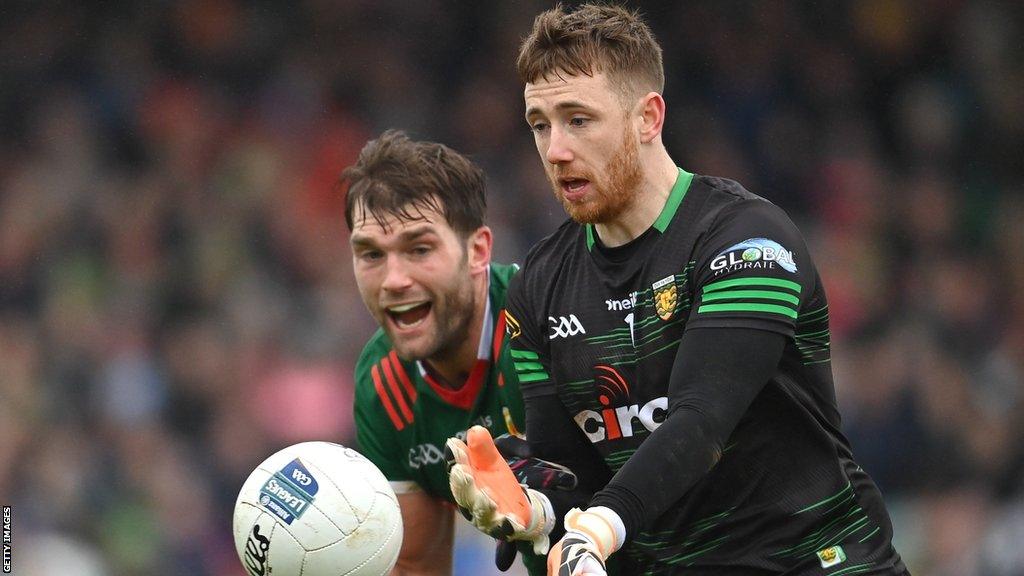 Aidan O'Shea tries to keep pace with Donegal goalkeeper Shaun Patton