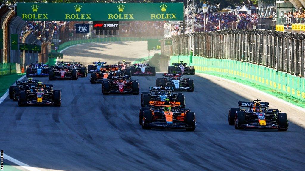 Max Verstappen passes Lando Norris at the start of the Sao Paulo Grand Prix