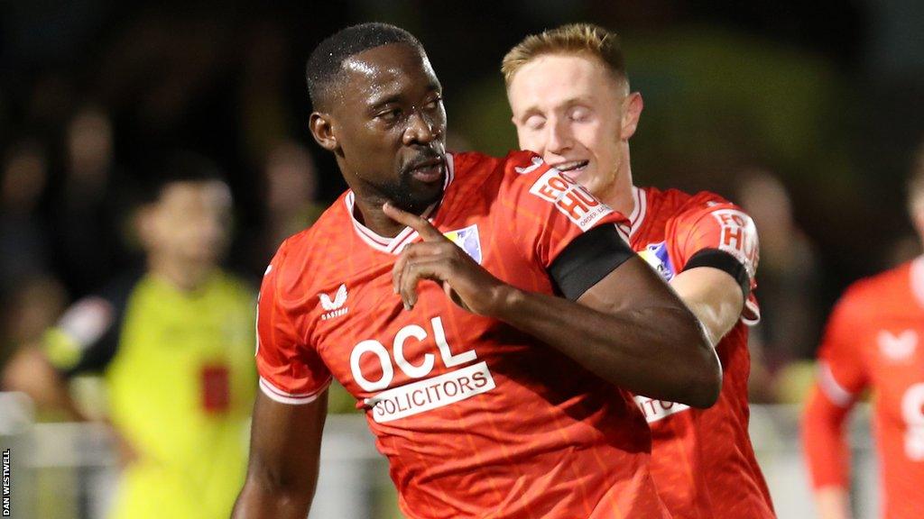 Lucas Akins celebrates scoring a goal