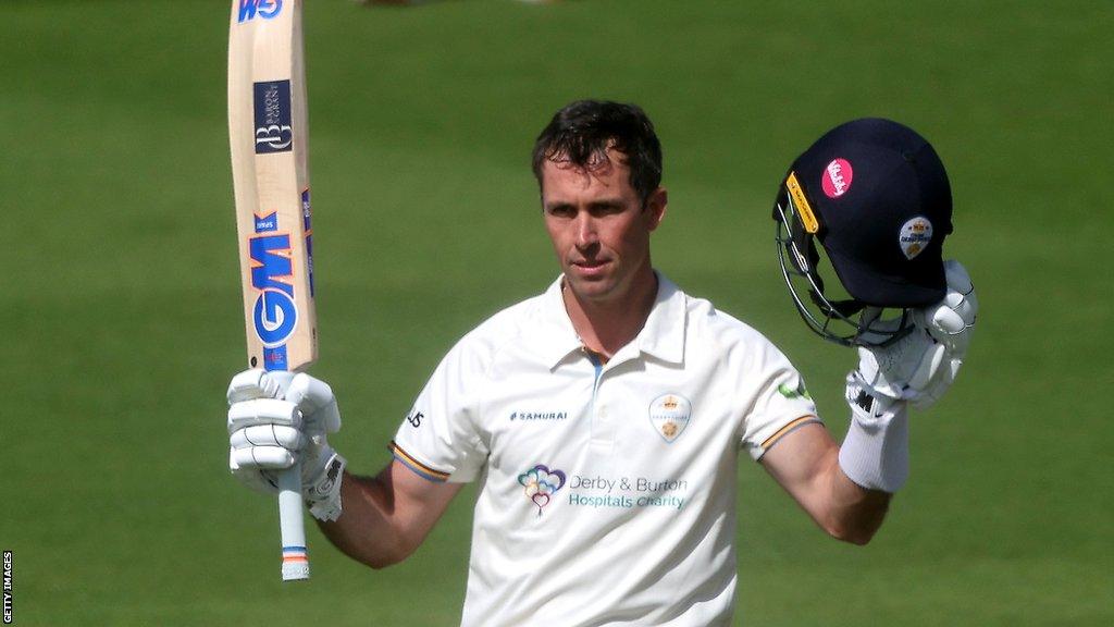 Derbyshire batter Wayne Madsen celebrates scoring a century