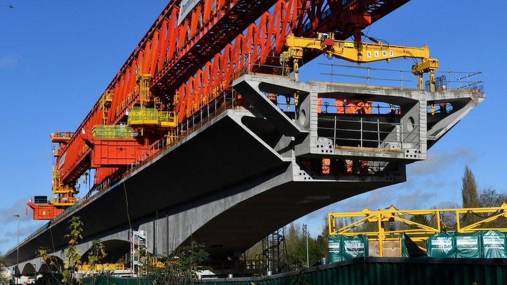 A 700 ton bridge building machine known as a 'launch girder', drops a pre-cast concrete section into place during construction of the HS2 Colne Valley Viaduct