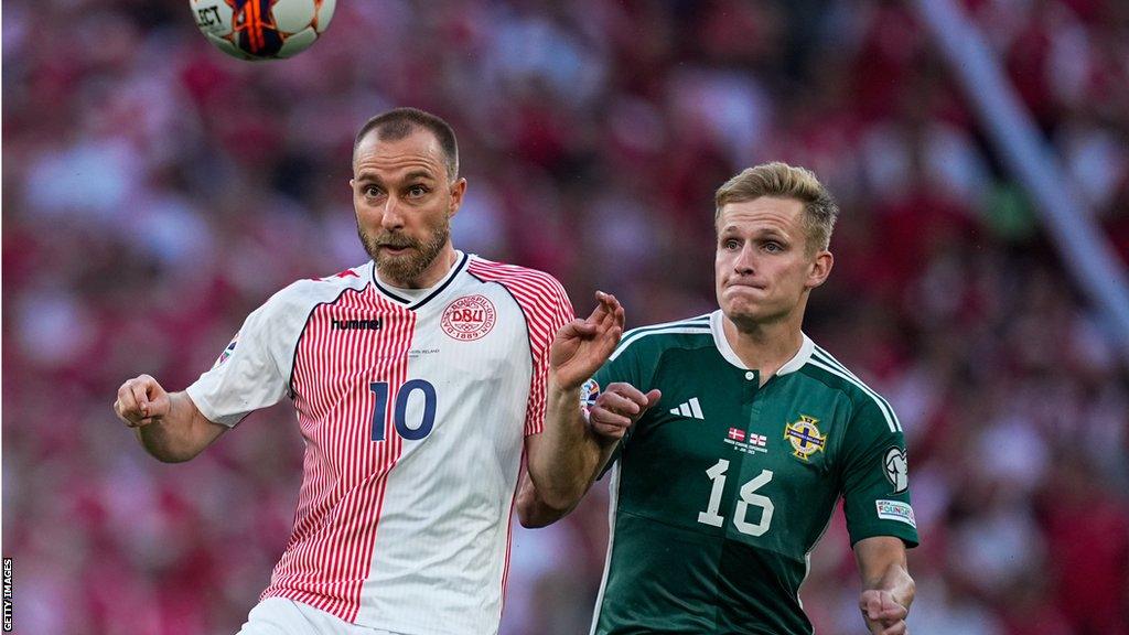 Ali McCann (right) battles with Denmark's Christian Eriksen during the Euro 2024 qualifier in June