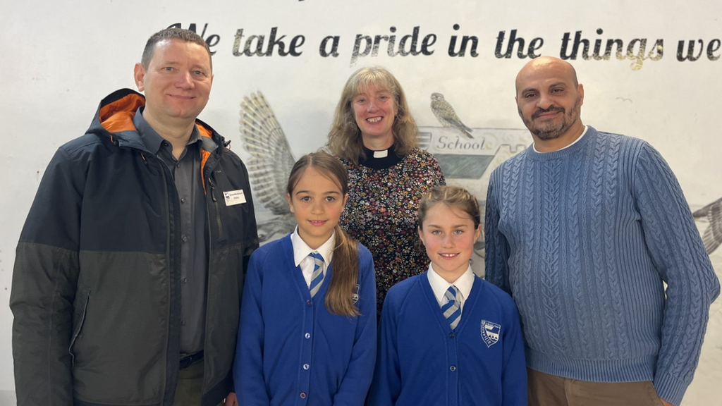 Toader Sarbu, The Reverend Helen Gunton and Alex Stroie with Year 5 pupils Clara and Annie