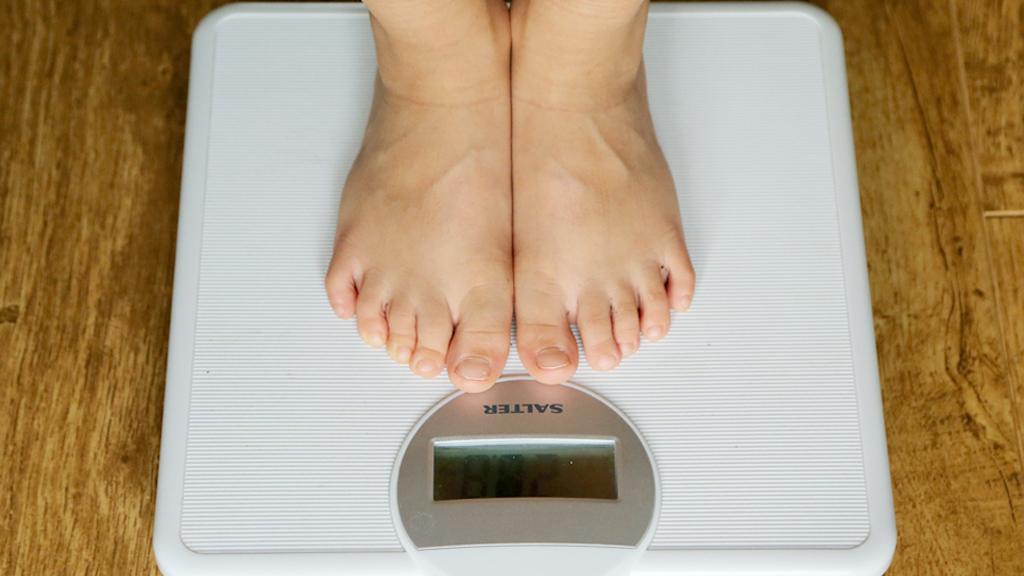 Feet on bathroom scales