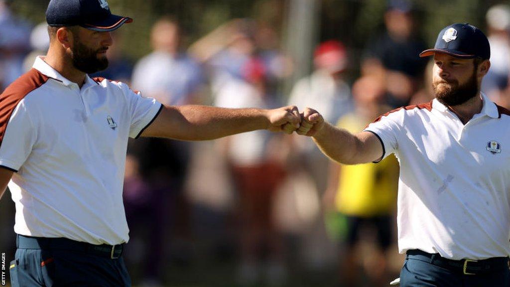 Jon Rahm and Tyrrell Hatton bump fists at the 2023 Ryder Cup in Rome