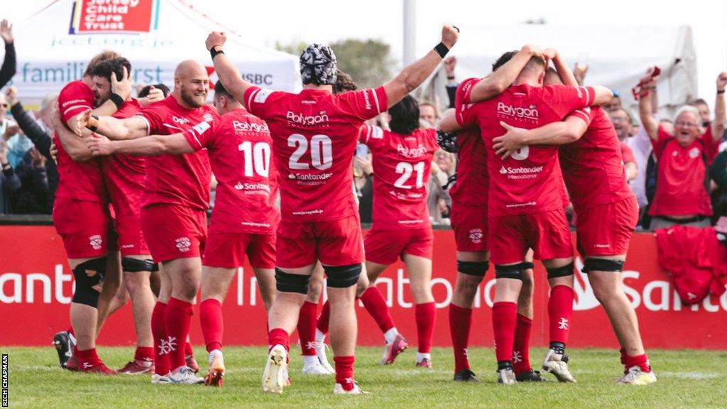 Jersey Reds celebrate winning the Championship