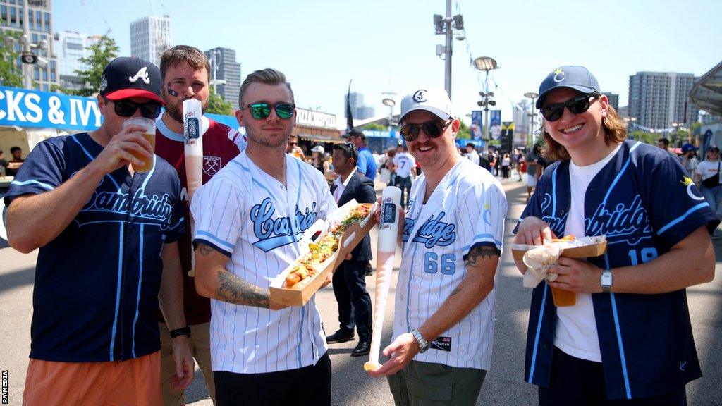 Players from Cambridge Baseball Club enjoying the ballpark food and drink and the MLB London Series in 2023