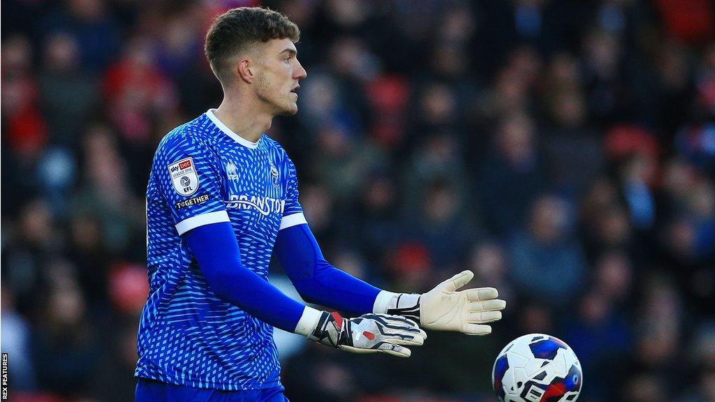 Goalkeeper Jordan Wright in action for Lincoln City