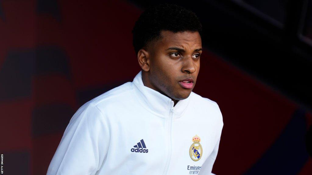 Rodrygo walks onto the pitch at the Estadio Santiago Bernabeu wearing a Real Madrid tracksuit