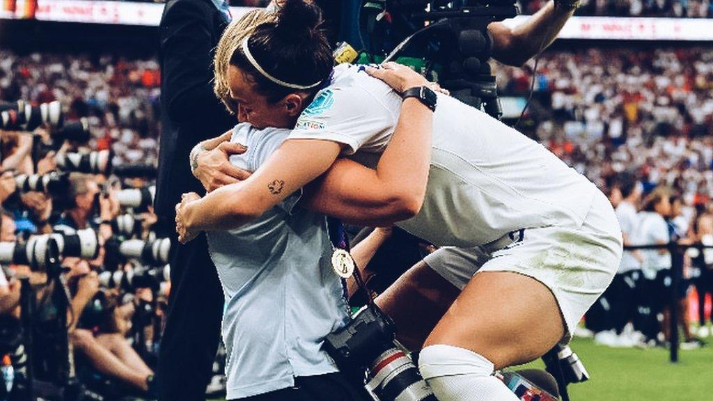 Lynne Cameron is hugged by Lucy Bronze