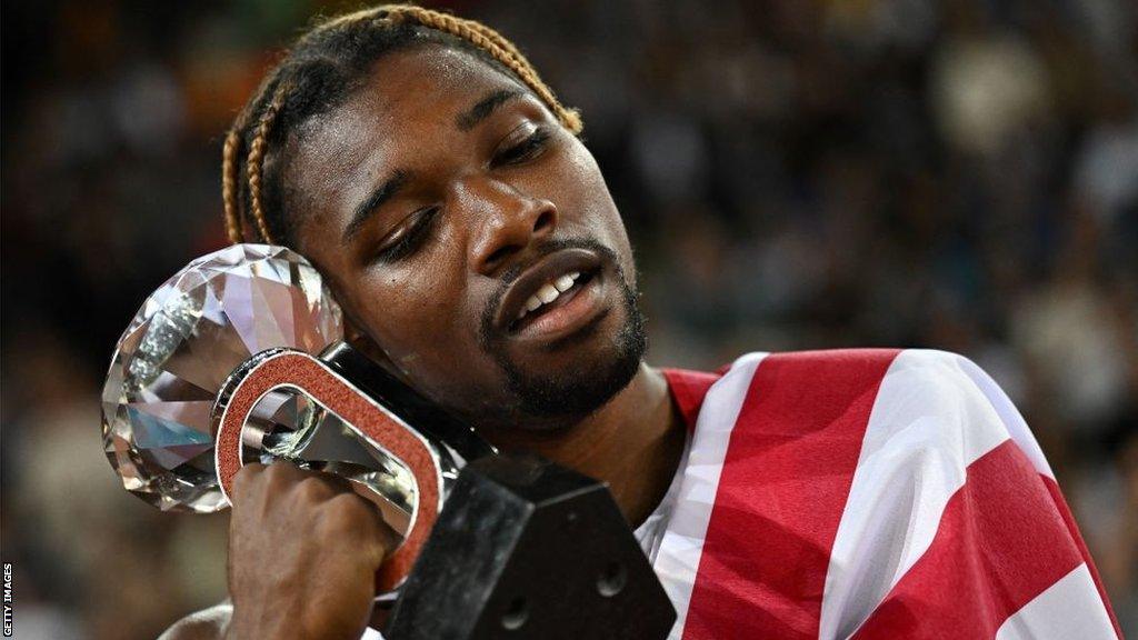 Noah Lyles with his Diamond League trophy in 2022