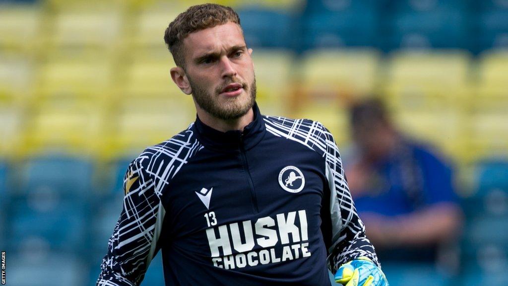 Ryan Sandford warming up for Millwall during a pre-match training session