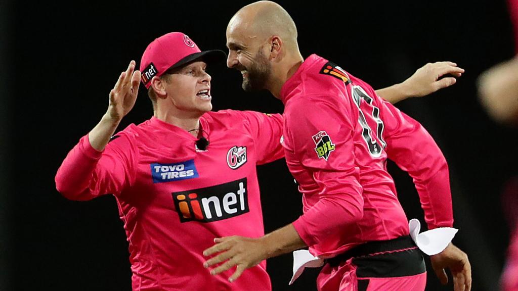 Sydney Sixers players Steve Smith and Nathan Lyon celebrate