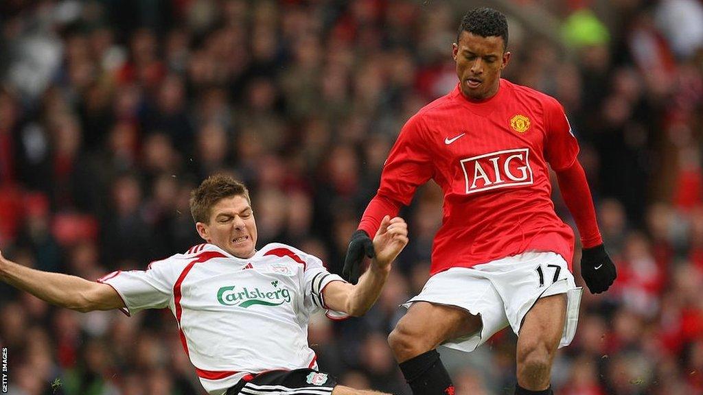 Liverpool's Steven Gerrard tackles Manchester United's Nani