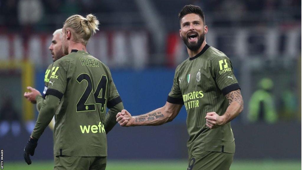 Olivier Giroud celebrates a goal for AC Milan