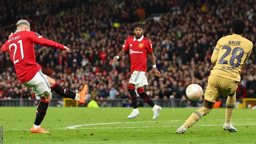 Antony (left) scores against Barcelona