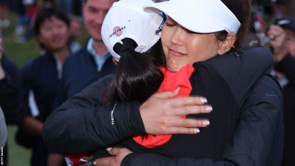 Michelle Wie West congratulates Rose Zhang on her victory