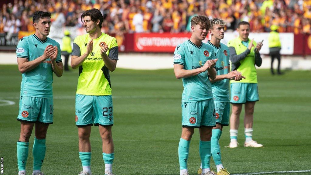 Dundee Utd players are dejected at full time as they're relegated during a cinch Premiership match between Motherwell and Dundee United at Fir Park