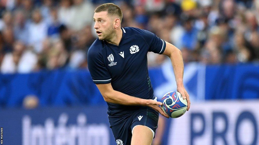 Finn Russell looks to pass the ball during Scotland's World Cup game against Tonga