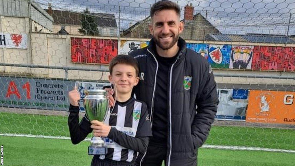 Former Swansea defender Angel Rangel alongside his son, who is also called Angel