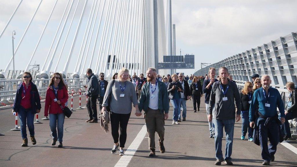 Walkers on bridge