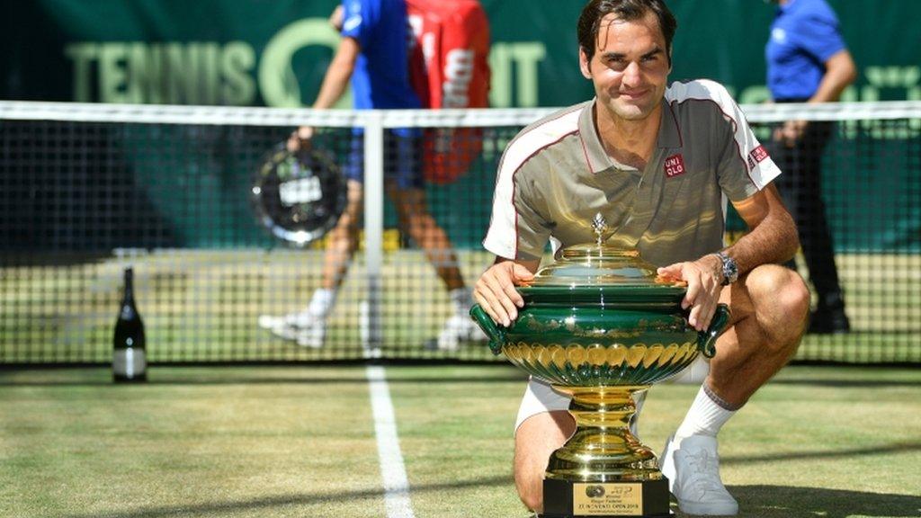 Roger Federer with the trophy