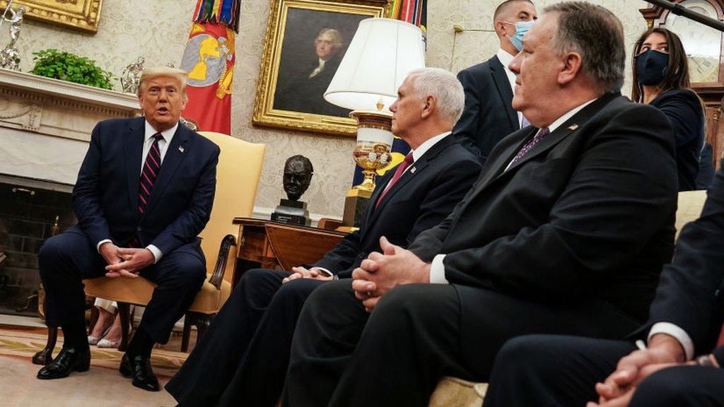 File photo showing US President Donald Trump speaking during a meeting with Vice-President Mike Pence (C) and Secretary of State Mike Pompeo (R) in the Oval Office (20 August 2020)