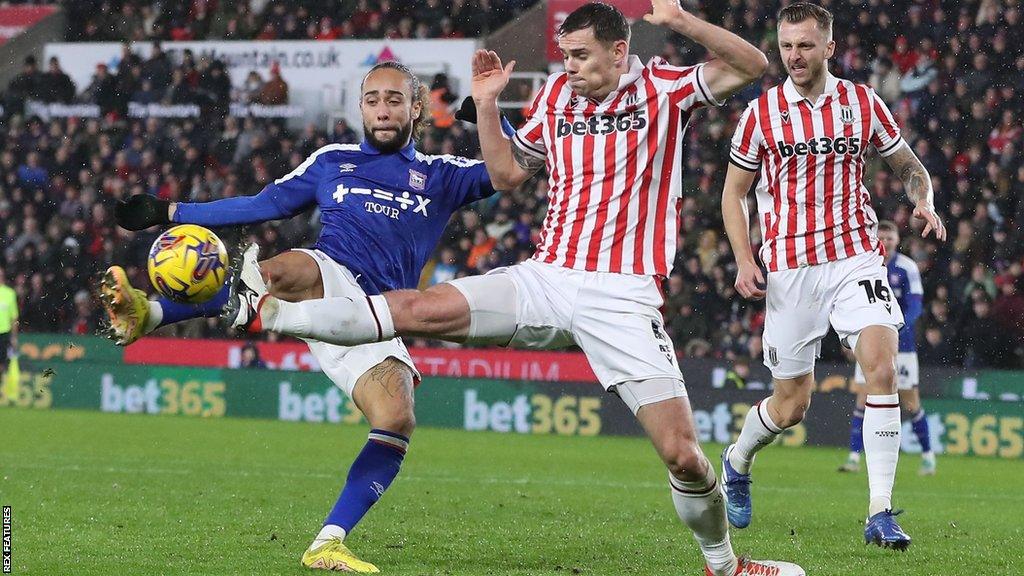 Michael Rose blocks a goal attempt by Ipswich's Marcus Harness