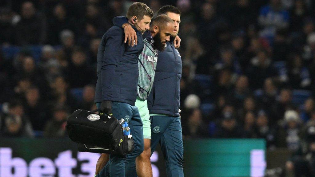 Bryan Mbeumo is assisted walking off the pitch during Brentford's Premier League defeat by Brighton