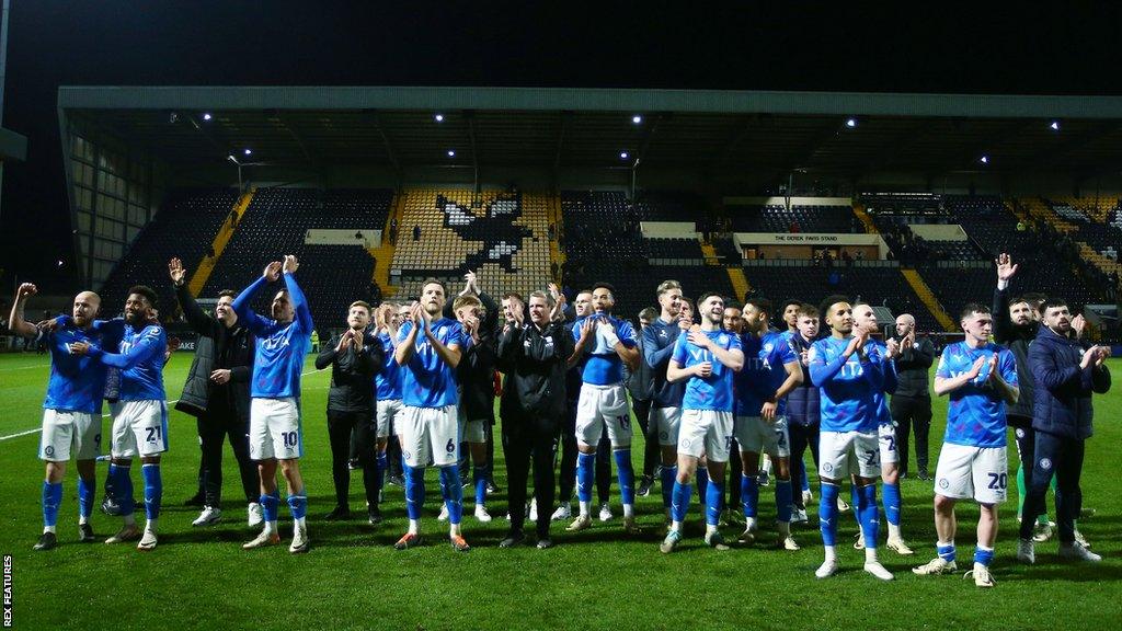 Stockport players applaud their fans