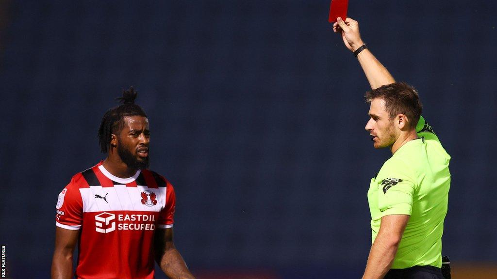 Shaq Forde is sent off by referee Ben Atkinson during Leyton Orient's defeat at Gillingham in the EFL Trophy